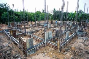 Landscape of house under construction site with reinforcement steelwork photo