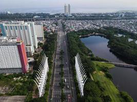 Jakarta, Indonesia 2021- Aerial view of highway in the morning and buildings photo