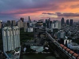 Jakarta, Indonesia 2021- Aerial view of sunset in the skyscrapers in the city of Jakarta photo