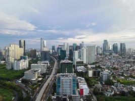 Jakarta, Indonesia 2021- Aerial view of highway intersection and buildings in the city of Jakarta photo