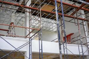 Perspective inside of house under construction with installation of insulator and electricity photo