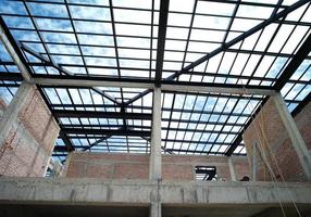 Steel structure for the roof of the house under construction photo