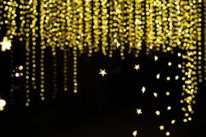 Abstract texture and background of colorful glittering bokeh lights with black background photo