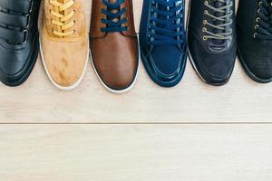 Leather shoes on wooden background photo