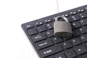 Padlock on computer keyboard photo