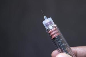 Hand holding insulin pens with copy space photo