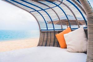 Luxury deck with pillow on the beach and sea photo