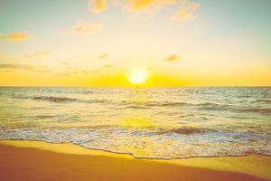 Sunset with sea and beach photo