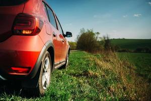 Red car in the countryside photo