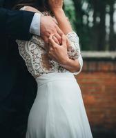 Bride and groom embracing photo