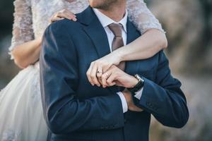 Bride embracing groom photo