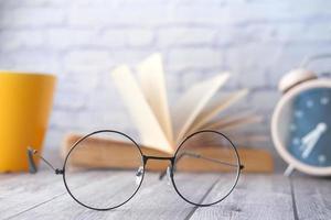 Circular eyeglass on table photo