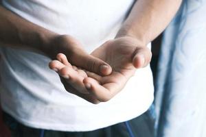 Man suffering pain in hand close up photo