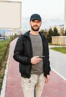 Man using smartphone and enjoying a beautiful day photo