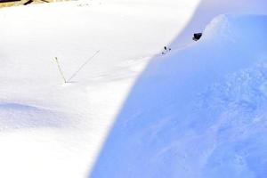 Snowy surface in winter with shadows in the evening photo