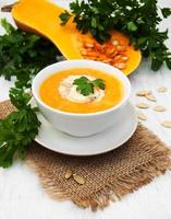 Pumpkin soup on a table photo