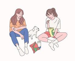 Two friends are sitting on the floor, eating snacks, watching the puppy and having fun. hand drawn style vector design illustrations.