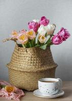 Basket with spring colorful tulips photo