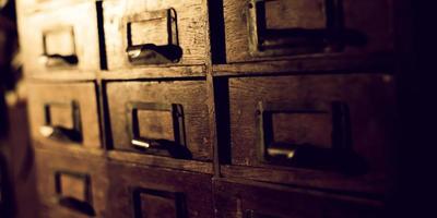 Old wooden wardrobe with small drawers photo