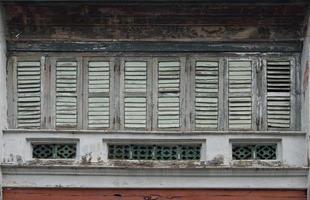 Antique wooden windows on an old building. Architectural elements.