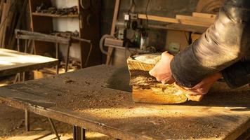 Sawing wood with a circular saw photo