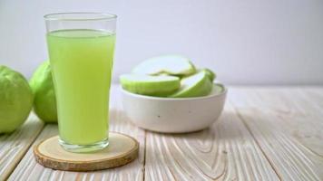 Fresh Guava Juice in a Tall Glass with Fruit video