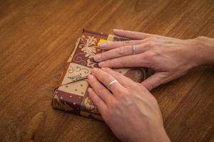 Young woman preparing gifts for loved ones at the party photo