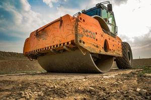Machine for soil consolidation in terrain when working in summer photo