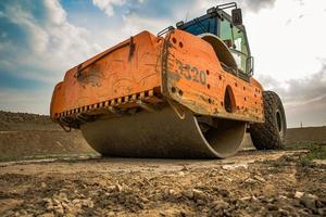 Machine for soil consolidation in terrain when working in summer photo