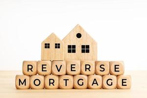 Reverse Mortgage words on wooden blocks on table photo