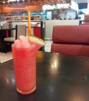 Watermelon smoothie on the table photo