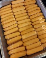 Sausages in a metal tray at a buffet photo