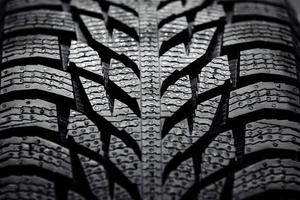 Close up of a new car tire, textured background photo