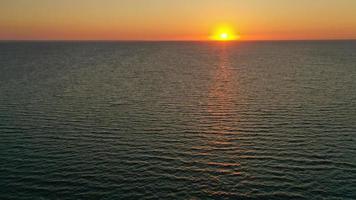 Beautiful sunrise over the horizon. Aerial photography. Sunrise in the ocean. photo