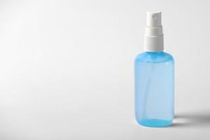 Clear hand sanitizer in a clear pump bottle isolated on a white background. Hand sanitizer is used for killing germs, bacteria and viruses photo