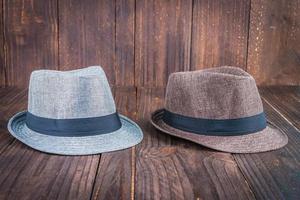 Beach hats on wooden background