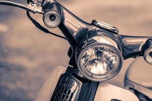 Vintage headlight lamp of a motorcycle photo