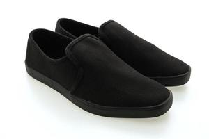 zapatos negros sobre fondo blanco foto
