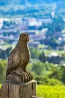 Wooden eagle craft on the fence at Maienfeld, Switzerland photo