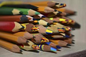 Lots of different colored pencils close up photo