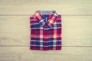 Shirt on wooden background photo