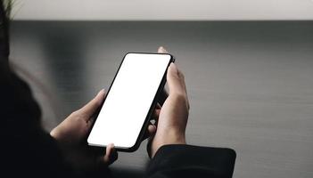 Close-up of a woman holding a phone mock-up photo