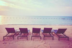 Sunbathing beds on the beach photo