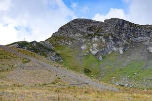 Mountain landscape with rocky slopes and cloudy blue sky in Sochi, Russia photo