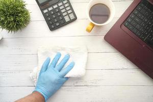 Top view of a person cleaning their desk photo