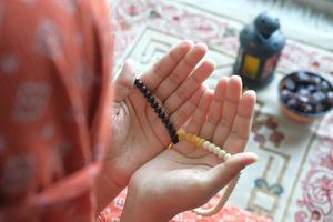 Prayer beads in hands photo