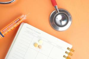 Medical flat lay on an orange background photo