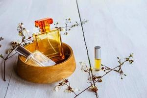 Perfume in a wooden bowl photo