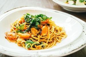 Spicy spaghetti and pasta with salmon photo