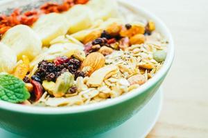 Mixed fruit with muesli and granola photo